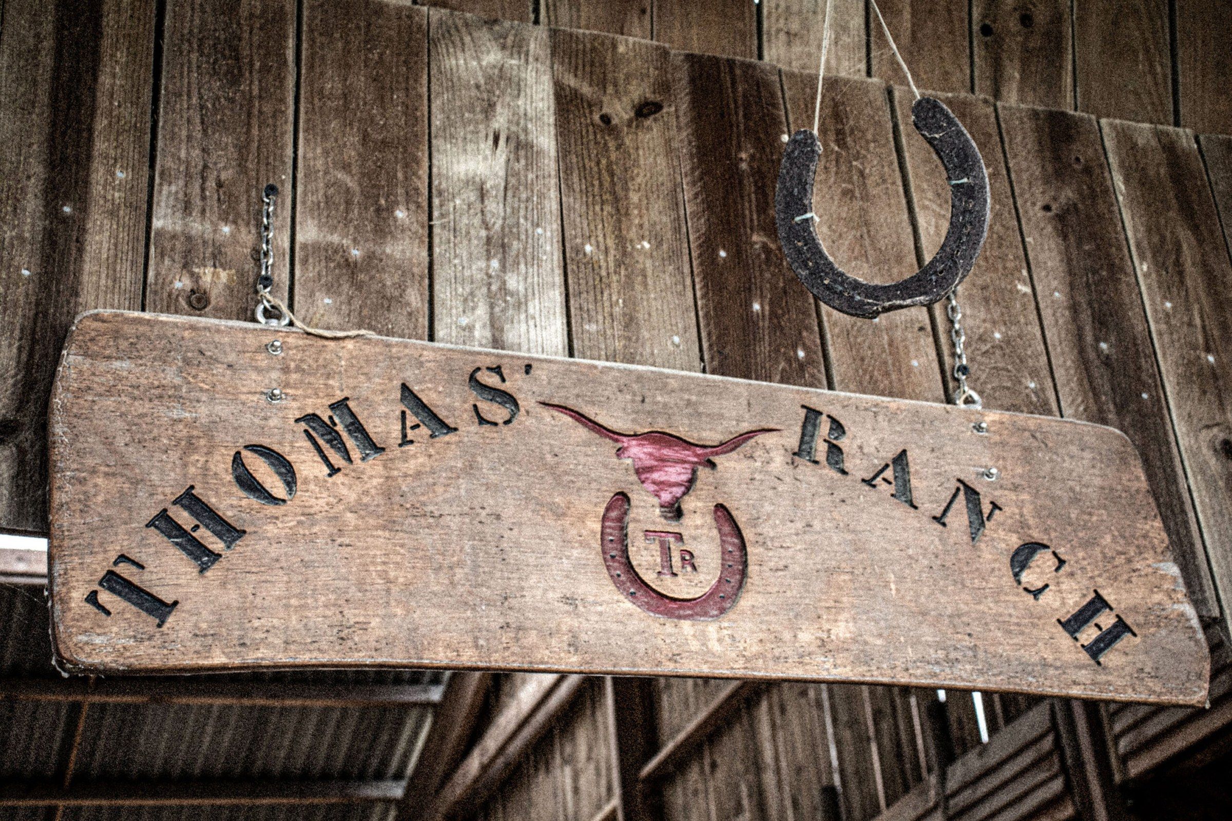 The wooden Thomas’ Ranch sign and its horseshoe