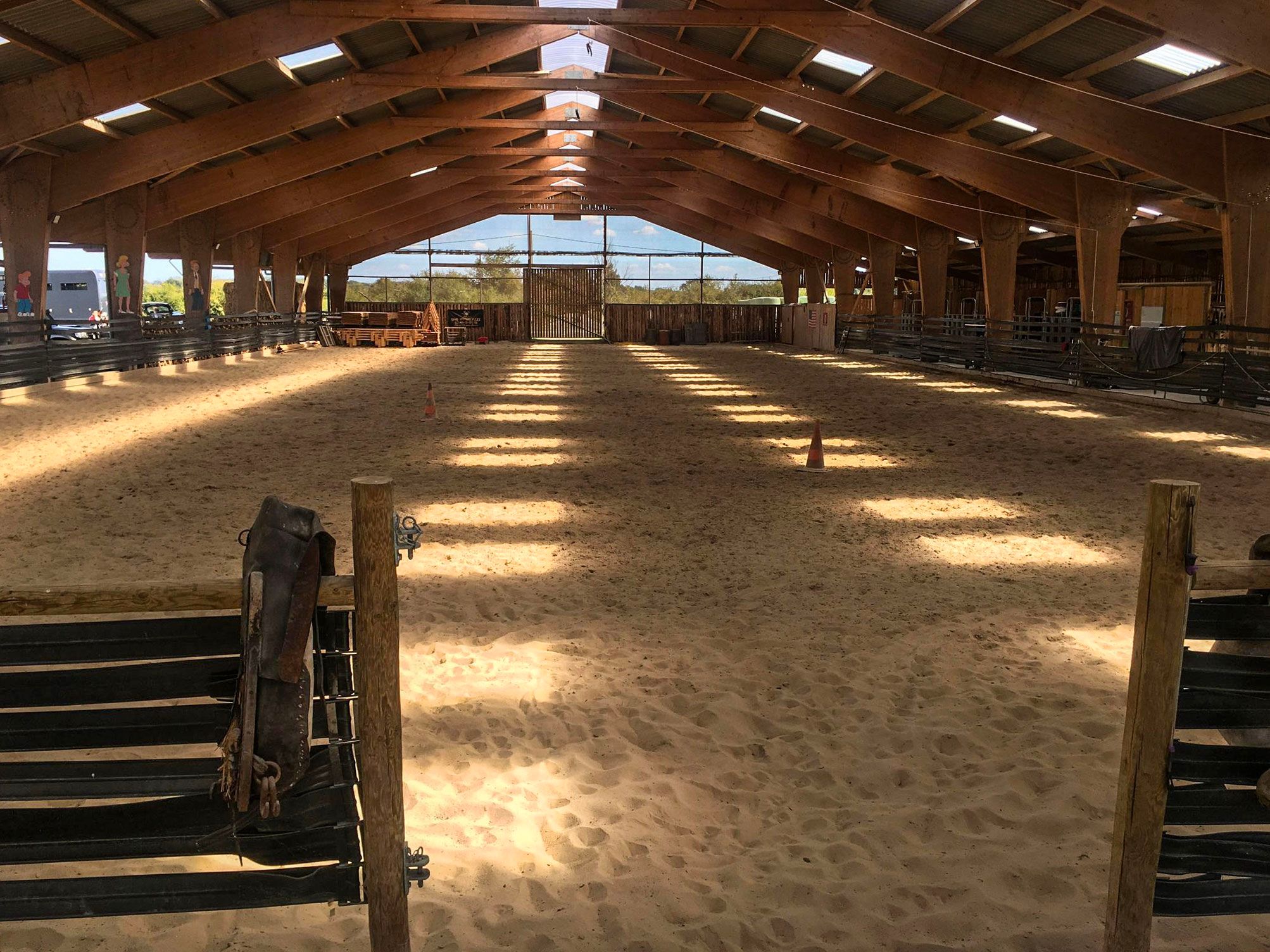 The ranch’s indoor arena and its timber frame